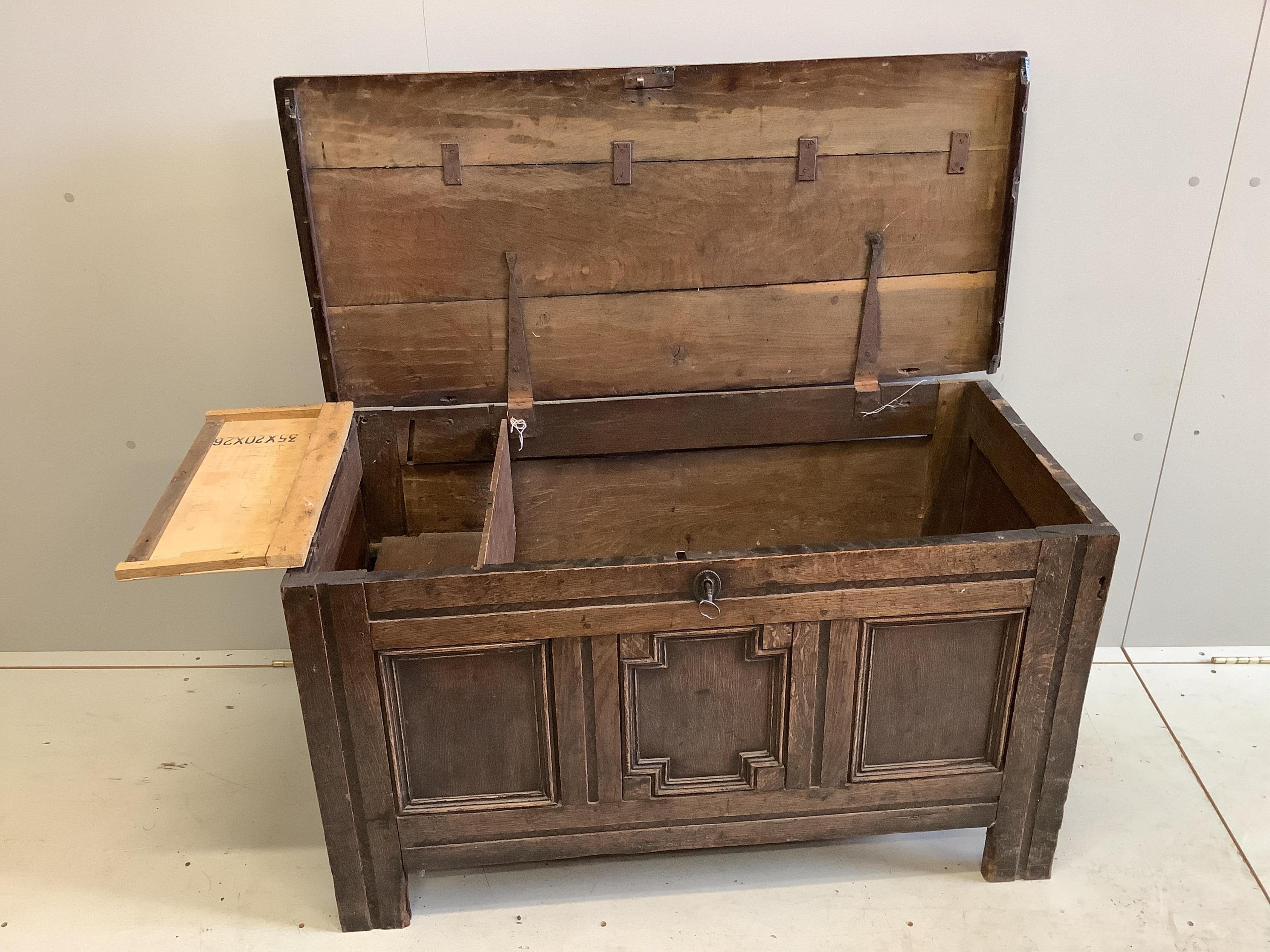 An early 18th century panelled oak coffer, width 108cm, depth 50cm, height 61cm. Condition - poor to fair